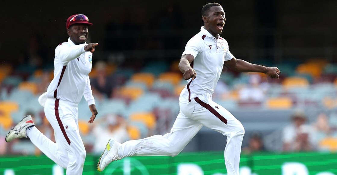 Shamar Joseph, right,  celebrates West Indies' win. Photo: AFP/Pat Hoelscher
