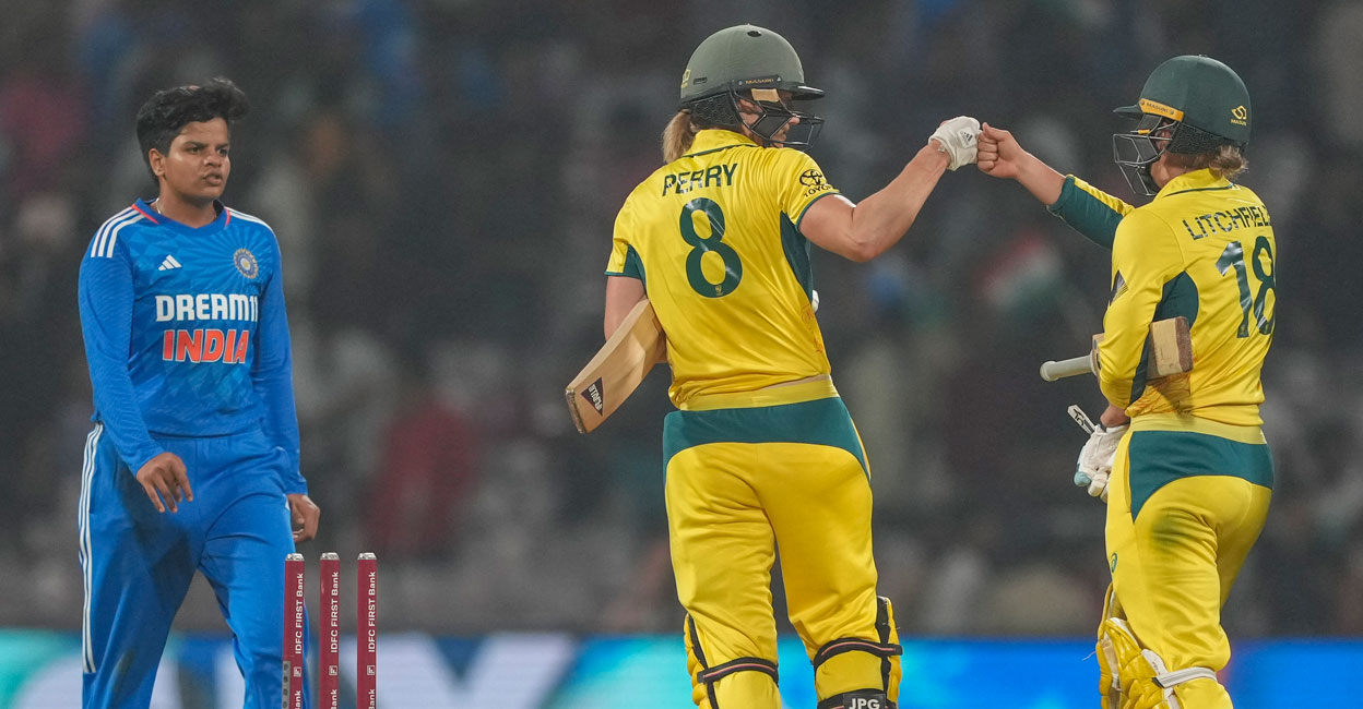 Australia's Ellyse Perry and Phoebe Litchfield celebrate after winning the 2nd T20I against India at DY Patil stadium in Navi Mumbai on Sunday. Photo: PTI