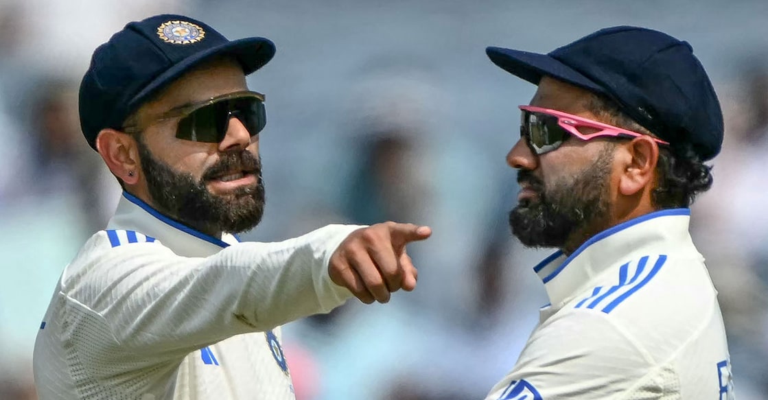 India's Virat Kohli talks with his captain Rohit Sharma during the second day of the second Test against New Zealand at the Maharashtra Cricket Association Stadium in Pune. Photo: AFP/ Punit Paranjpe