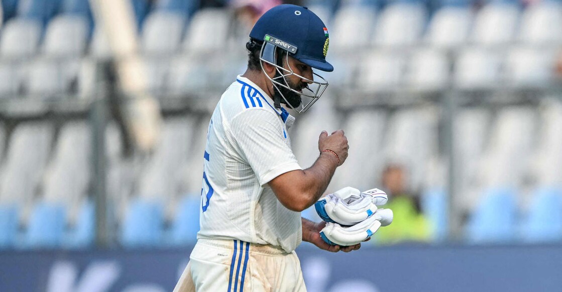Rohit Sharma walks back after being dismissed for 18 off 18. Photo: AFP