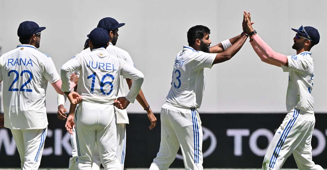 India's Jasprit Bumrah celebrates the dismissal of Australia's Travis Head with teammates on day four of the first Test at Optus Stadium in Perth on November 25, 2024. Photo: AFP/ Saeed Khan