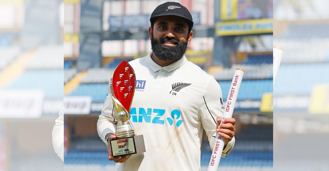 New Zealand's Glenn Phillips (R) clicks family photographs of Ajaz Patel (2R) as he poses with his player of the match trophy after their team's win against India at the end of their third and final Test cricket match in the Wankhede Stadium of Mumbai on - 1 Ajaz Patel poses with his player-of-the-match award. Photo: Blackcaps
