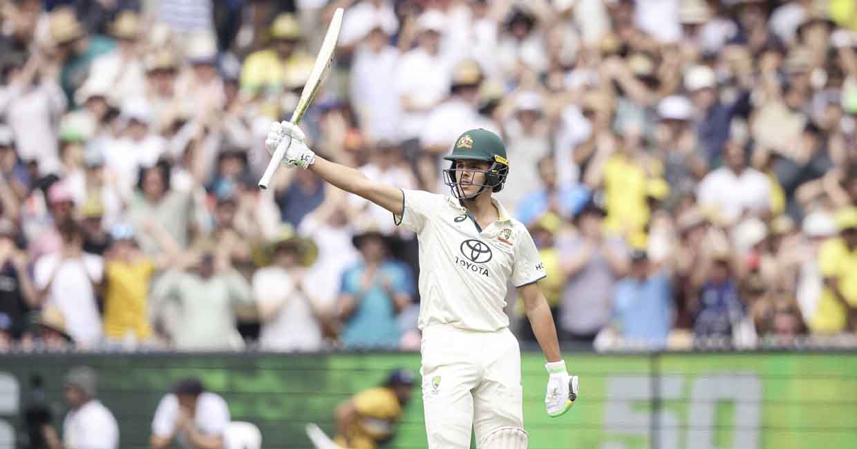 CRICKET-AUS-IND Australia's Sam Konstas raises his bat after passing 50 runs on day one of the fourth cricket Test match between Australia and India at the Melbourne Cricket Ground (MCG) in Melbourne on December 26, 2024. (Photo by Martin KEEP / AFP) / -- IMAGE RESTRICTED TO EDITORIAL USE - STRICTLY NO COMMERCIAL USE --