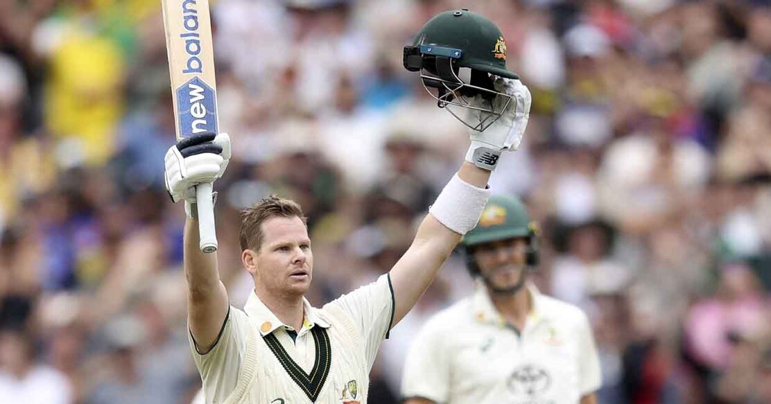 Australia's Steve Smith celebrates reaching his century (100 runs) on the second day of the fourth cricket Test match between Australia and India at the Melbourne Cricket Ground (MCG) in Melbourne on December 27, 2024. (Photo by Martin KEEP / AFP) / -- IMAGE RESTRICTED TO EDITORIAL USE - STRICTLY NO COMMERCIAL USE --