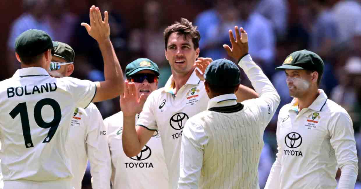 Australia's Pat Cummins (C) celebrates with teammates after dismissing India's Nitish Kumar Reddy  on the third day of the second cricket Test match between Australia and India at the Adelaide Oval in Adelaide on December 8, 2024. (Photo by William WEST / AFP) / -- IMAGE RESTRICTED TO EDITORIAL USE - STRICTLY NO COMMERCIAL USE --