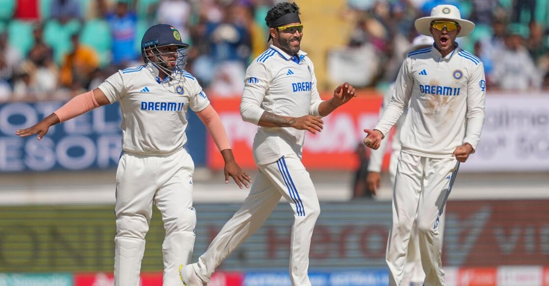 Ravindra Jadeja, centre, celebrates with teammates after trapping Jonny Bairstow in front of the wicket. Photo: PTI/Kunal Patil