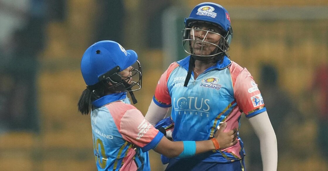 Sajana Sajana, right, celebrates with teammate Amanjot Kaur after hitting the winning shot. Photo: PTI//Shailendra Bhojak