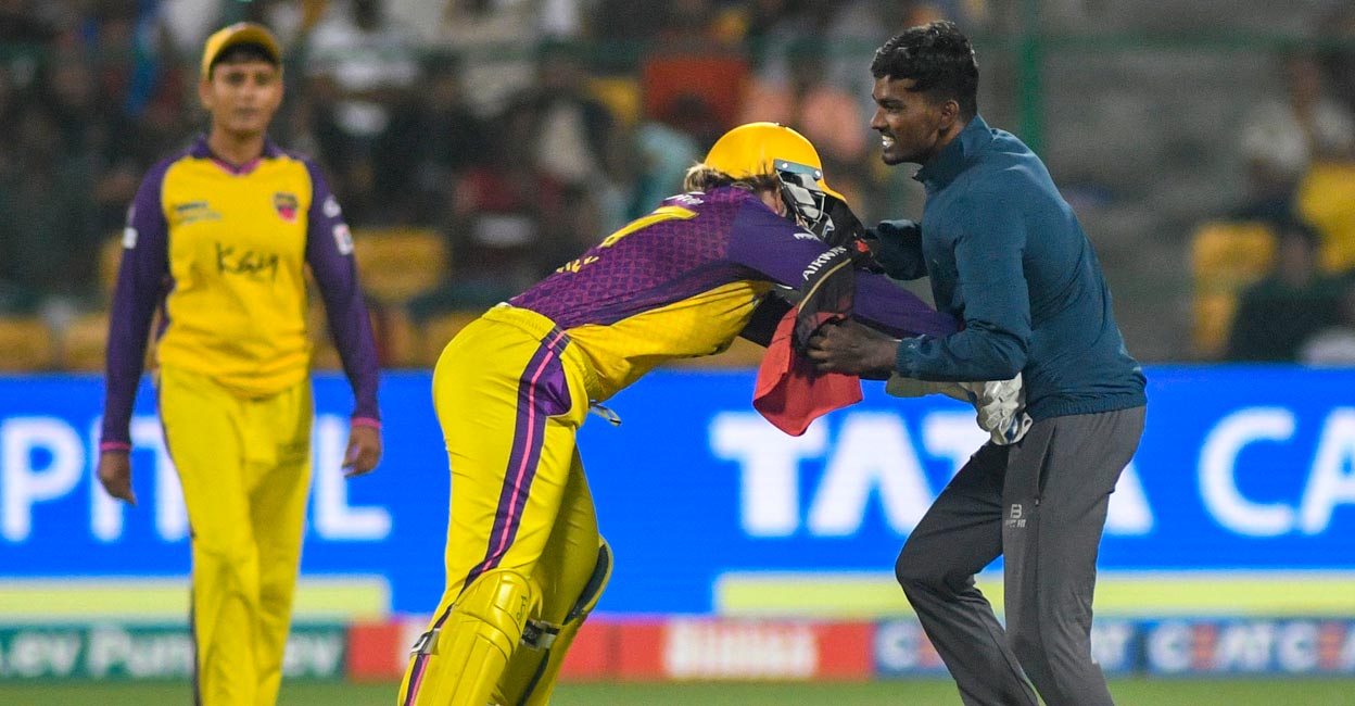 Alyssa Healy tried to grab the pitch invader. Photo: IANS 