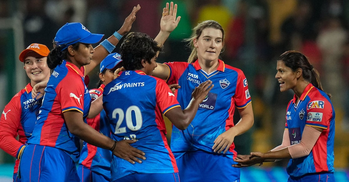 Delhi Capitals players celebate a wicket against Royal Challengers Bangalore at M Chinnaswamy Stadium in Bengaluru on Thursday. Photo: PTI