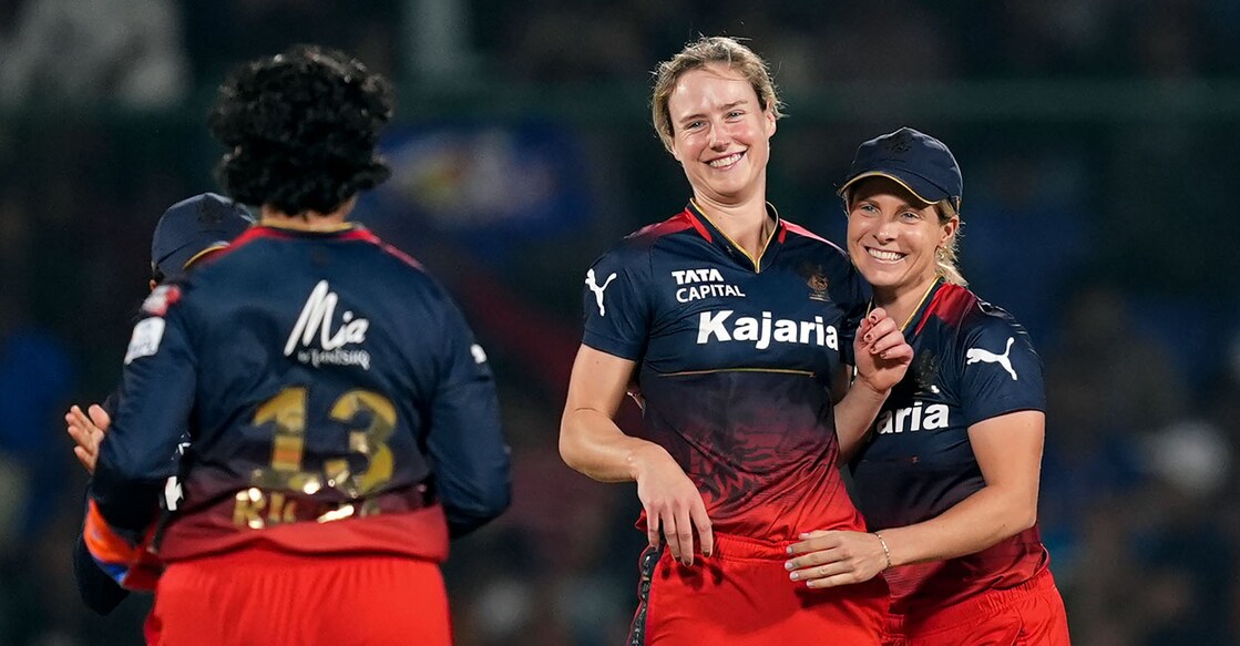 Royal Challengers Bangalore bowler Ellyse Perry celebrates the wicket of Mumbai Indians batter Harmanpreet Kaur during the Women's Premier League match in New Delhi on Tuesday. Photo: PTI