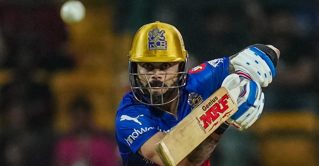 Virat Kohli plays a shot against Punjab Kings. Photo: PTI/Shailendra Bhojak