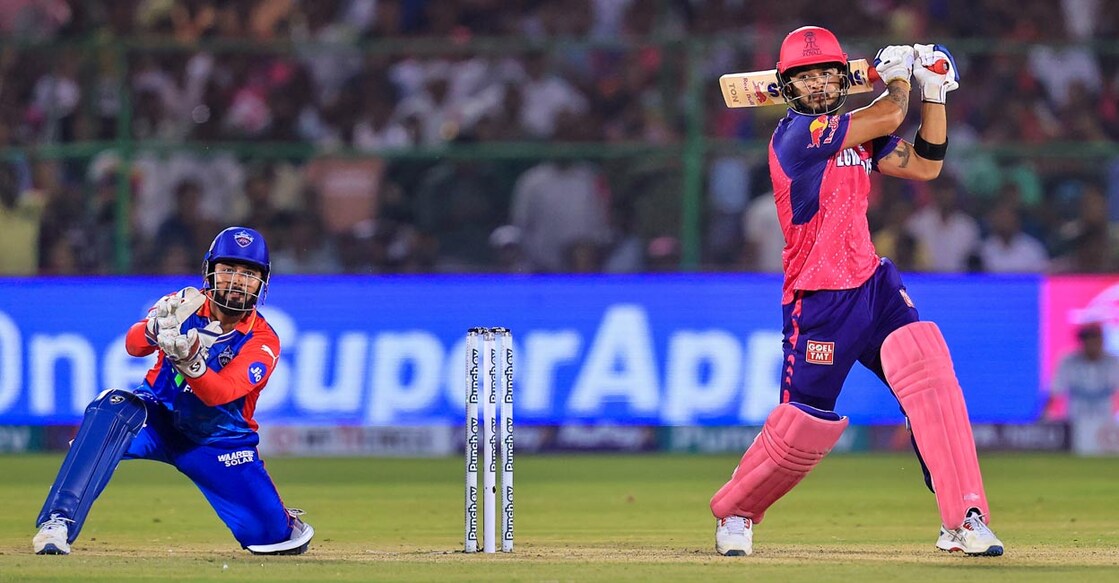 Riyan Parag smashes one through the off side. Photo: PTI