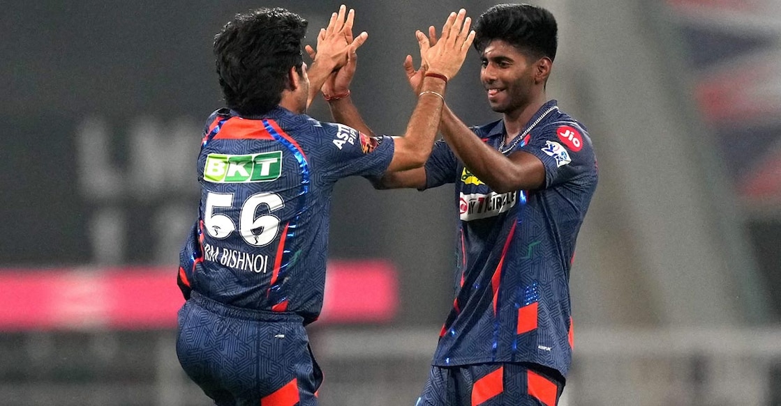 Ravi Bishnoi congratulates Mayank Yadav on picking up a wicket. Photo: PTI/Atul Yadav