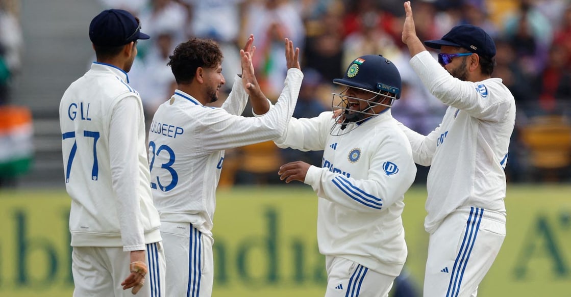 Kuldeep Yadav celebrates with teammates after taking the wicket of Ollie Pope. Photo: Reuters/Adnan Abidi