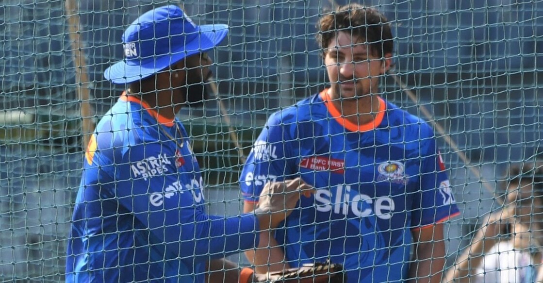 Mumbai Indians' batting coach Kieron Pollard and Tim David. File photo: IANS