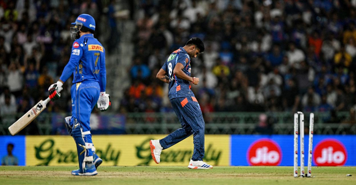 Mayank Yadav celebrates after taking the wicket of Mumbai Indians' Mohammad Nabi. Photo: AFP/Arun Sankar
