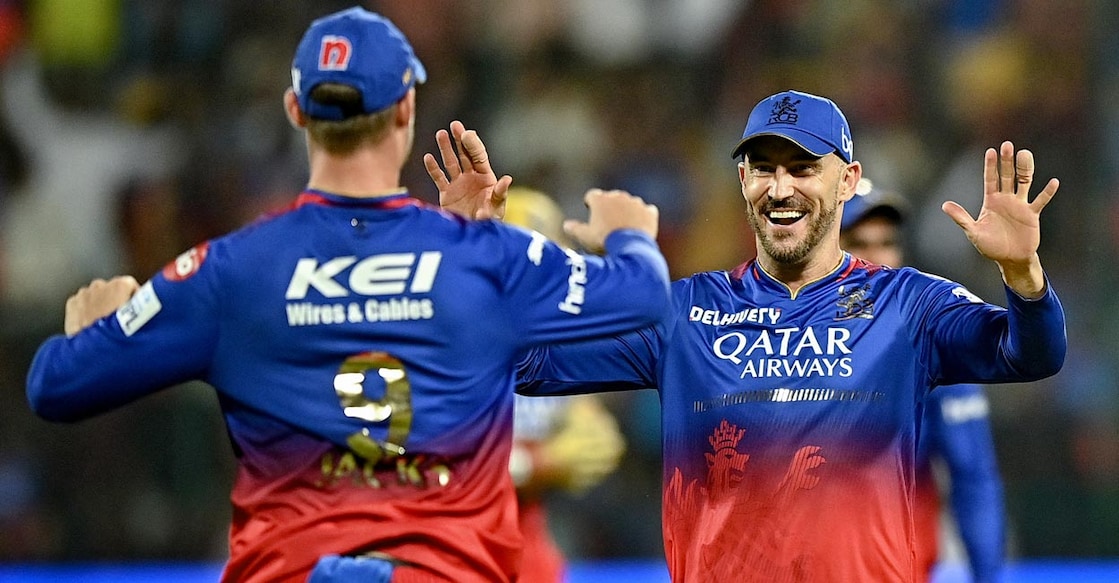 Faf du Plessis, right, celebrates the dismissal of Delhi Capitals opener David Warner. Photo: AFP/Idrees Mohammed