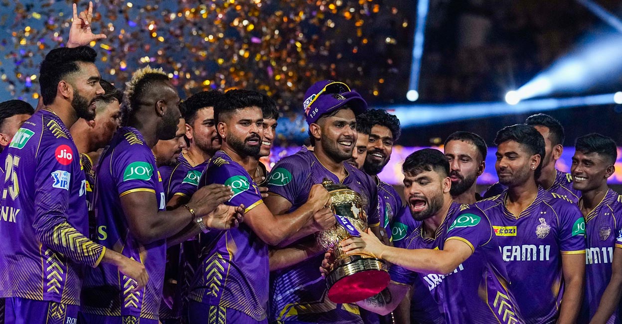 KKR players celebrate with the IPL trophy. Photo: PTI/R Senthil Kumar