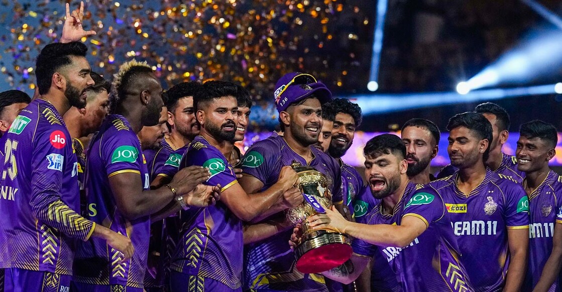KKR players celebrate with the IPL trophy. Photo: PTI/R Senthil Kumar