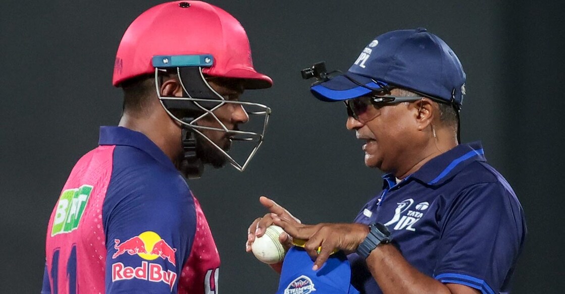 Umpire K N Ananthapadmanabhan has a word with Sanju Samson. Photo: IANS/Biplab Banerje