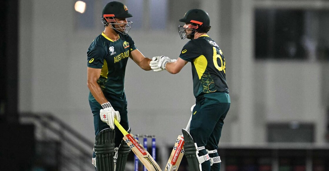 Marcus Stoinis and Travis Head during their match-winning stand. Photo: AFP/Timothy A Clary