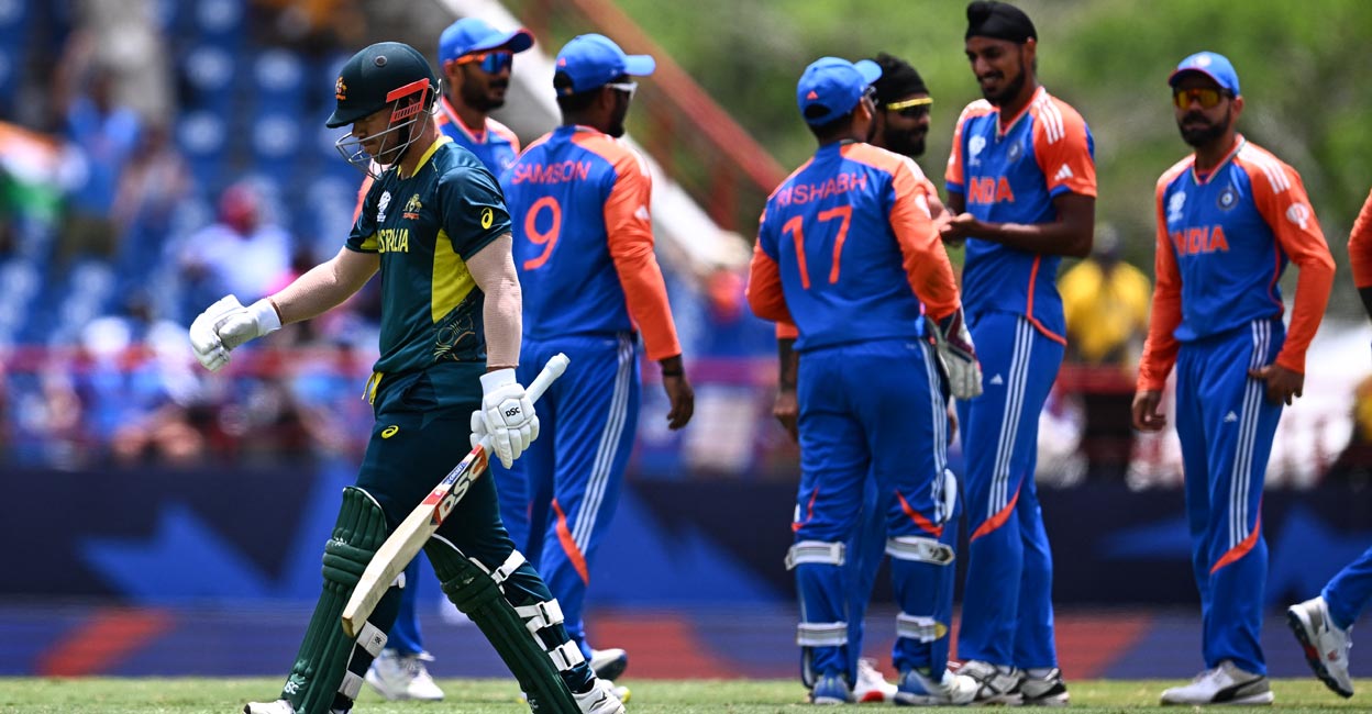 David Warner returns to the pavilion after being dismissed by Arshdeep Singh in his final game for Australia. Photo: AFP/Chandan Khanna