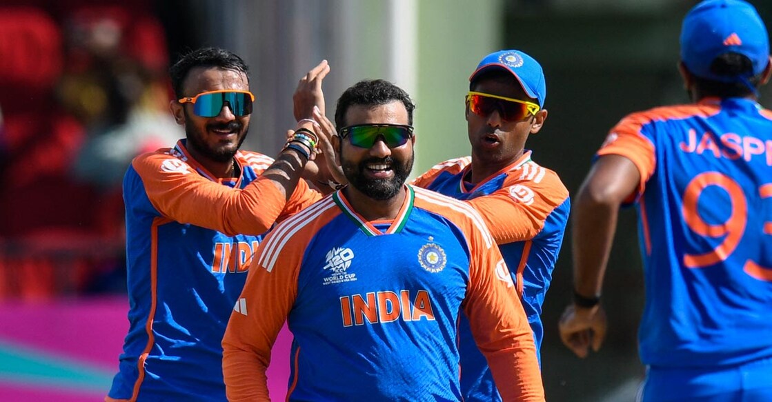 Axar Patel celebrates with teammates after a strike. Photo: AFP/Randy Brooks