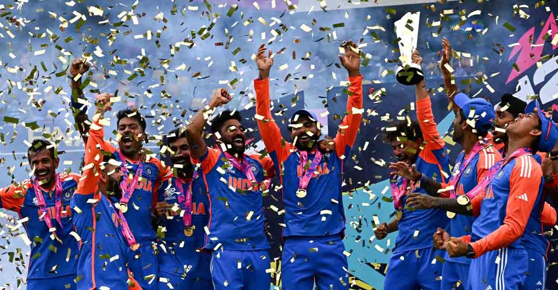TOPSHOT - Team India celebrates with the trophy after winning the ICC men's Twenty20 World Cup 2024 final cricket match between India and South Africa at Kensington Oval in Bridgetown, Barbados, on June 29, 2024. (Photo by CHANDAN KHANNA / AFP)