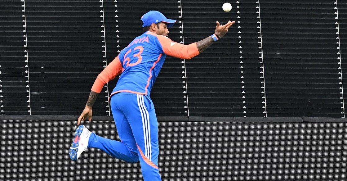 Suryakumar Yadav lobs the ball back into play. Photo: AFP/Chandan Khanna