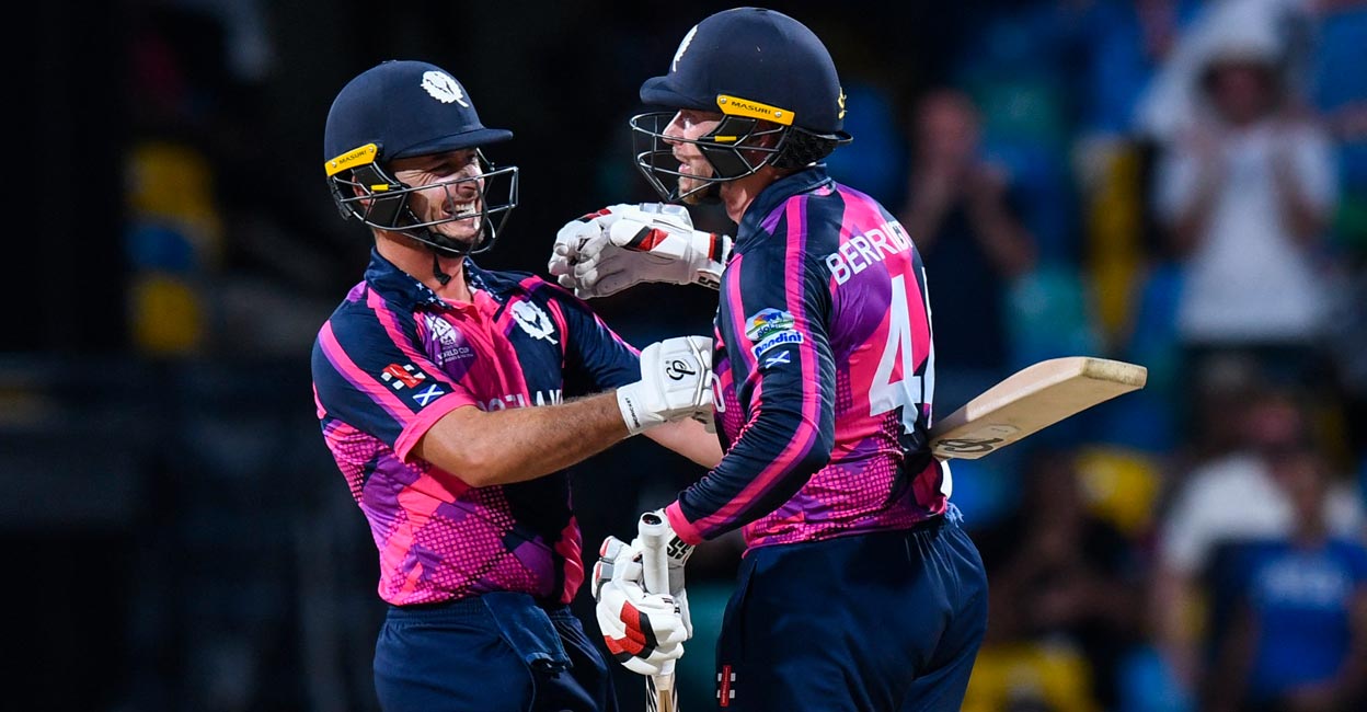 Scotland's Chris Greaves, left, and captain Richie Berrington celebrate their victory. Photo: AFP/Randy Brooks