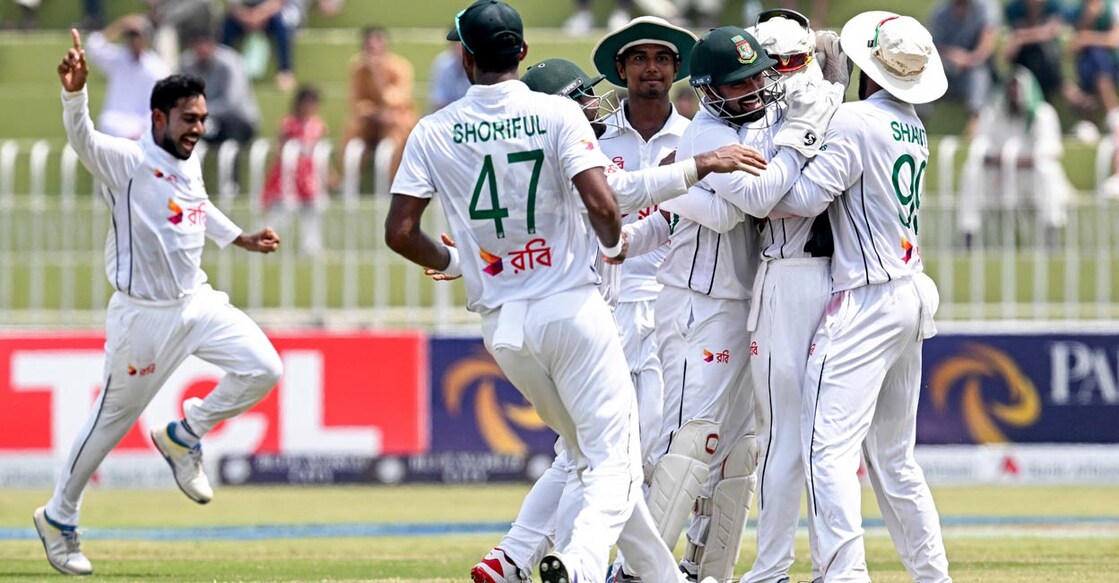 Mehidy Hasan Miraz, left, celebrates with teammates after taking the wicket of Agha Salman. Photo: AFP/Farooq Naeem