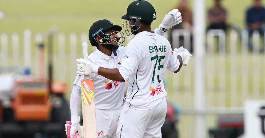 Bangladesh's Mushfiqur Rahim (L) and Shakib Al Hasan celebrate after winning the second and last Test match against Pakistan. Photo: Aamir Qureshi/AFP