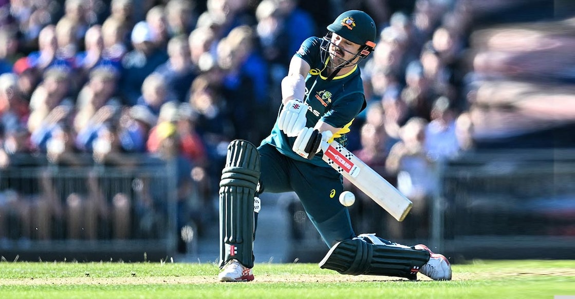 Travis Head attempts a big hit. Photo: AFP/Andy Buchanan