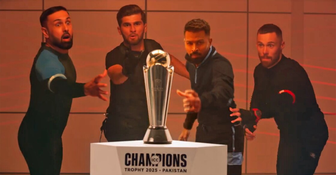 Mohammed Nabi, Shaheen Afridi, Hardik Pandya and Phil Salt dive forward to grab the Champions Trophy prize. Photo: Screengrab/ICC