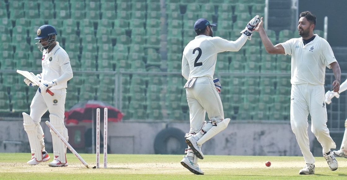 Madhya Pradesh's Avesh Khan (right) celebrates the wicket of Kerala captain Sachin Baby on day two of their Ranji Trophy in Thiruvananthapuram. 
