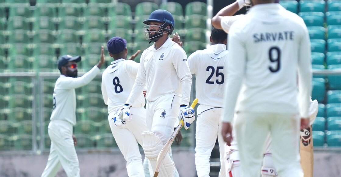 Kerala players celebrate the wicket of Madhya Pradesh's Rajat Patidar. Photo: Special arrangement