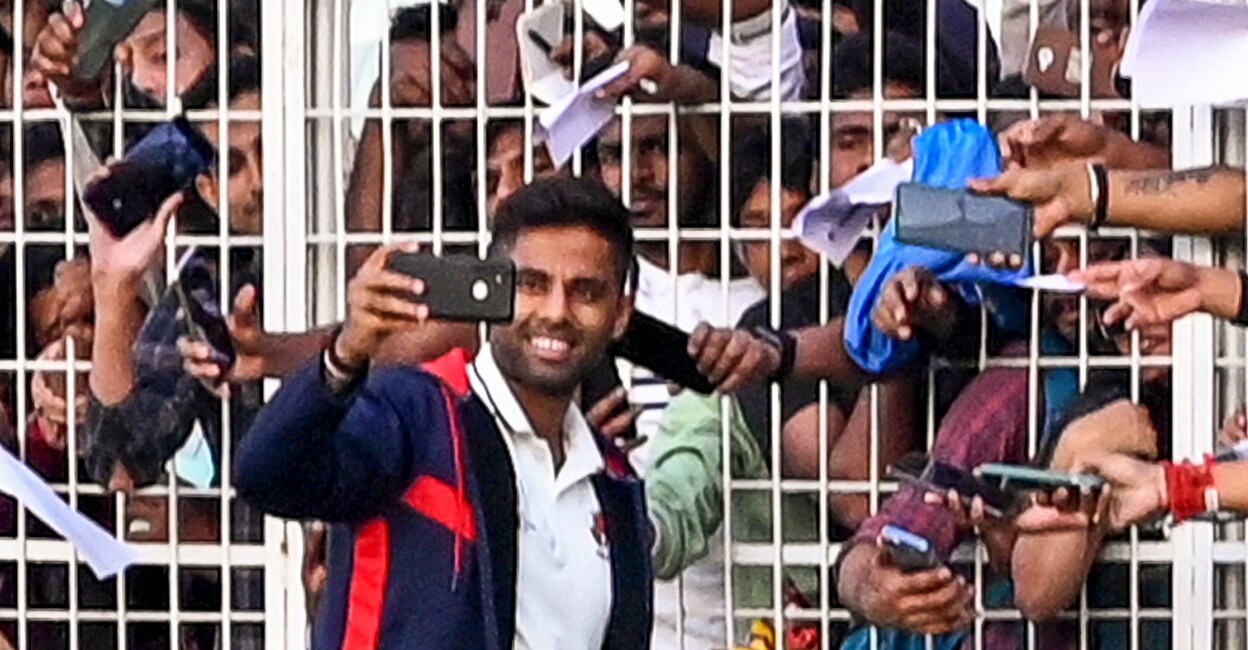 Suryakumar Yadav takes a selfie with fans at the Eden Gardens in Kolkata. Photo: PTI