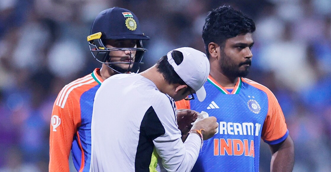 Sanju Samson receives treatment after injuring his finger during India's fifth T20I against England in Mumbai. Photo: Reuters/Anushree Fadnavis