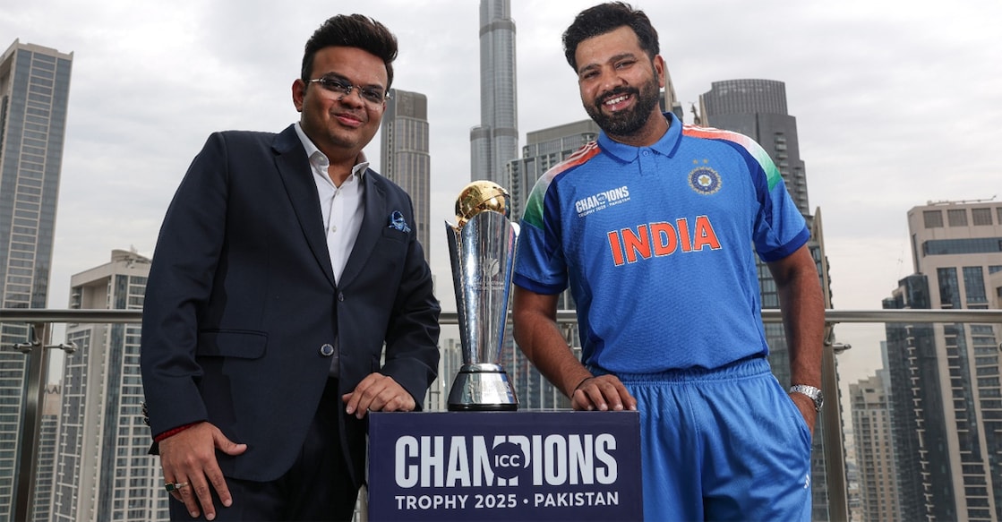 ICC Chairman Jay Shah poses with Indian captain Rohit Sharma next to the ICC Champions Trophy winners trophy. Photo: X/@ICC