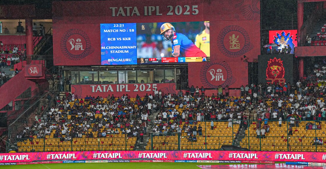 Spectators leave as the Indian Premier League (IPL) 2025 match between Royal Challengers Bengaluru and Kolkata Knight Riders was abandoned due to rain in Bengaluru on May 17, 2025. File photo: PTI
