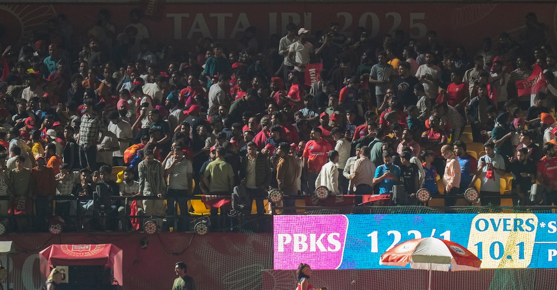Spectators leave after the Indian Premier League (IPL) 2025 T20 cricket match between Punjab Kings and Delhi Capitals was suspended, at the HPCA Stadium, in Dharamsala on May 8, 2025. Photo: PTI
