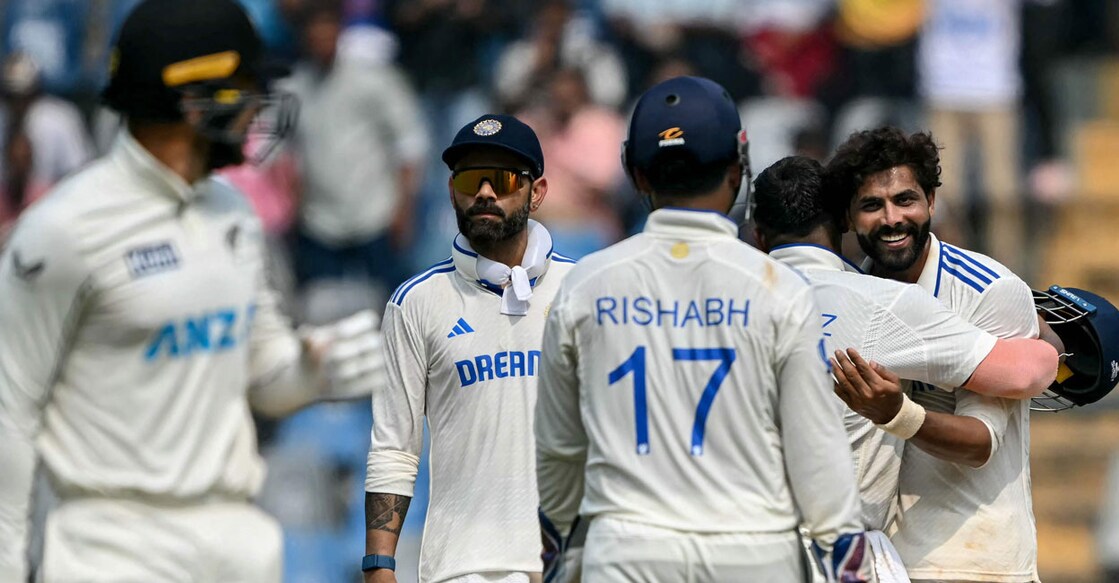 India's Ravindra Jadeja celebrates with teammates after taking the wicket of New Zealand's Tom Blundell during the first day of the third Test cricket at the Wankhede Stadium in Mumbai on November 1, 2024. Photo: AFP/Indranil Mukherjee