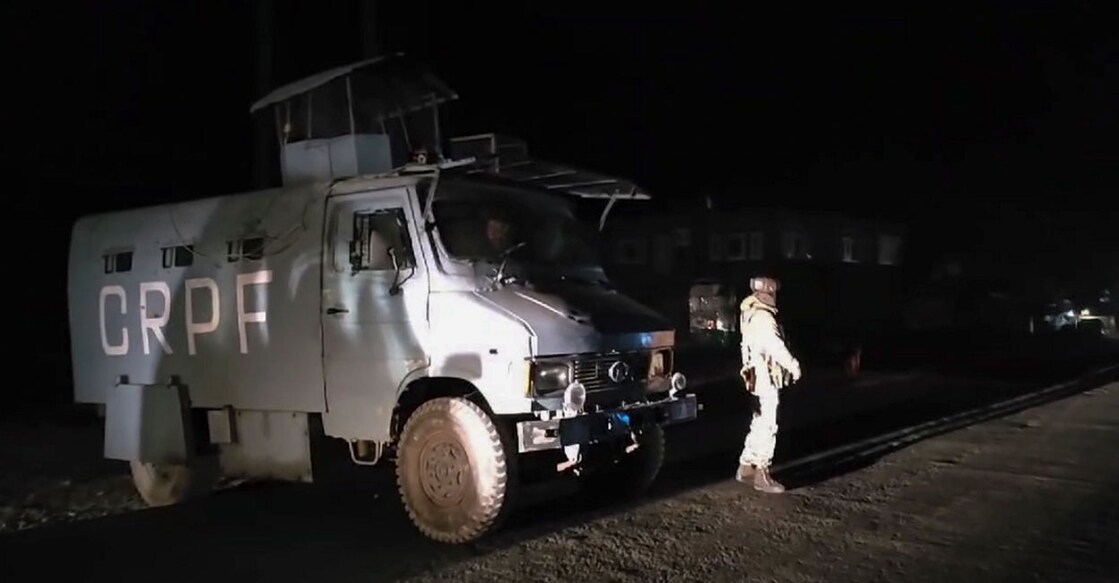 A security personnel stands guard as security forces cordon off the area after a terrorist attack, in Ganderbal district, Jammu & Kashmir on Sunday. Photo: Screengrab/PTI