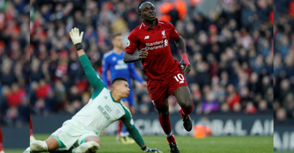 Liverpool beat lowly Cardiff City to top Premier League