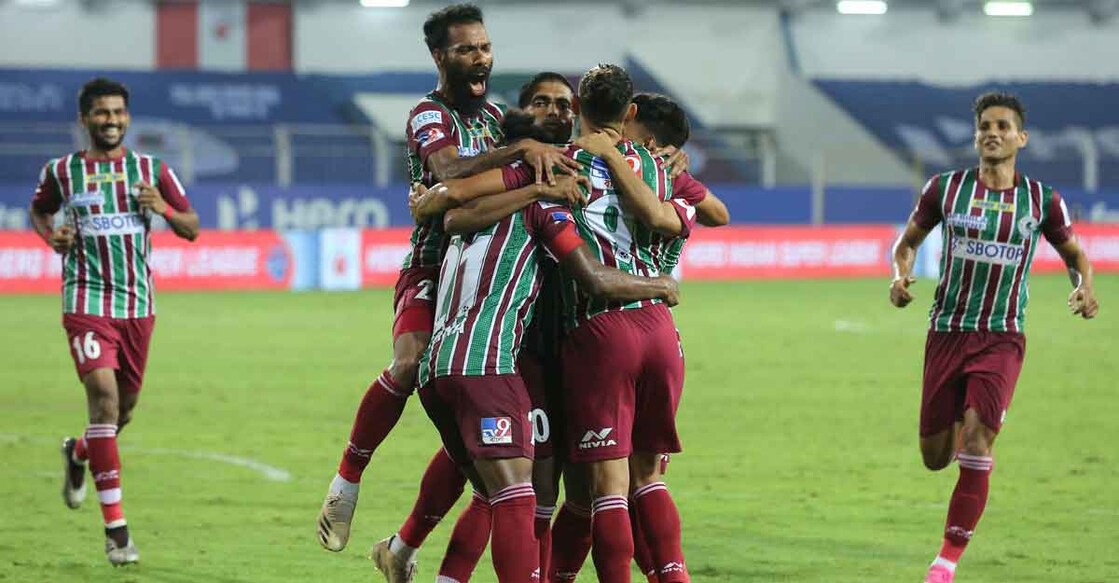 ATK Mohun Bagan players celebrate David Williams' injury-time goal. Photo: AFP