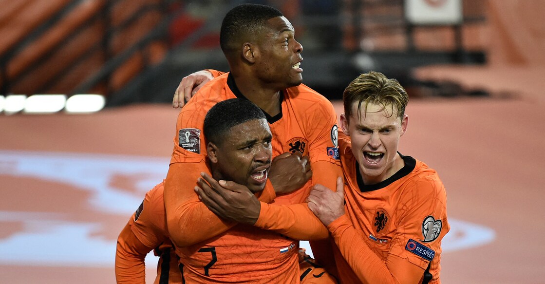 Netherlands' forward Steven Bergwijn, left, celebrates with teammates after scoring their opening goal. Photo: AFP