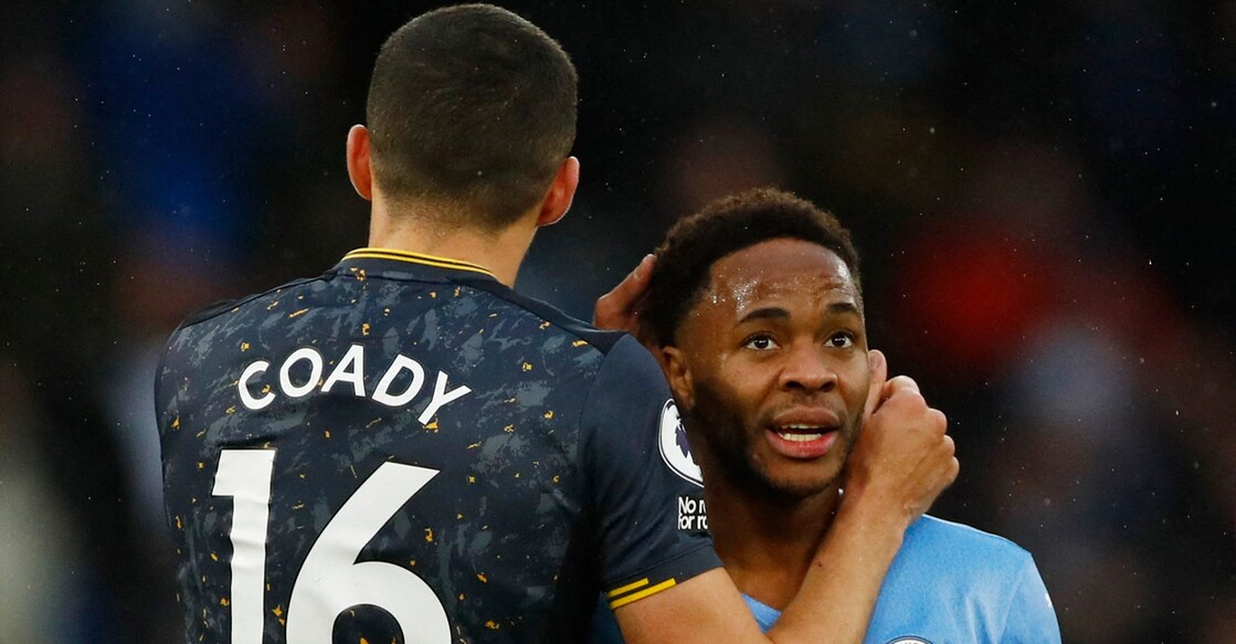 Manchester City's Raheem Sterling with Wolverhampton Wanderers' Conor Coady after the match. Photo: Action Images via Reuters/Jason Cairnduff