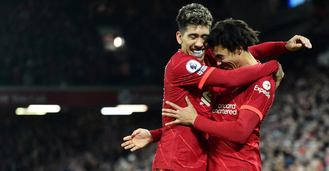 Liverpool's Trent Alexander-Arnold, right, celebrates with Roberto Firmino after scoring their third goal. Photo: Reuters /Peter Powell