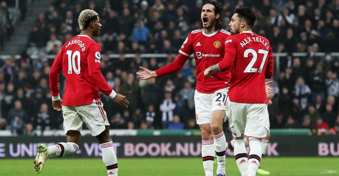 Edinson Cavani, centre, celebrates with Alex Telles and Marcus Rashford after scoring their equaliser. Photo: Reuters/Scott Heppell