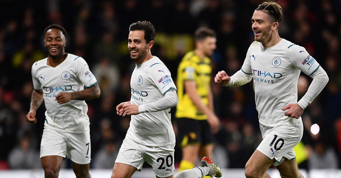 Manchester City's Bernardo Silva, second left, celebrates with teammates after scoring their third goal. Photo: AFP/ Ben Stansall